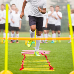 Boy Soccer Player In Training. Young Soccer Players at Practice Session